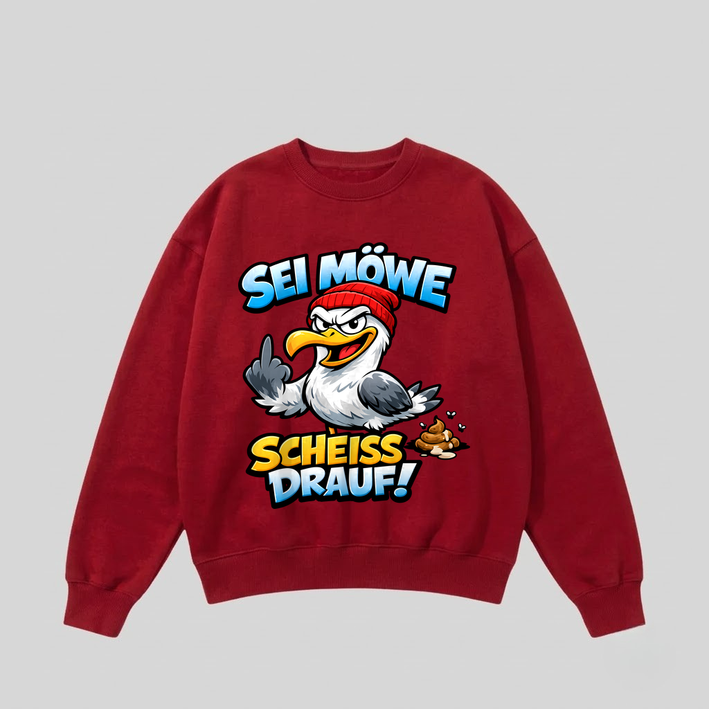 Roter Pullover mit Spruch „Sei Möwe – Scheiß drauf!“